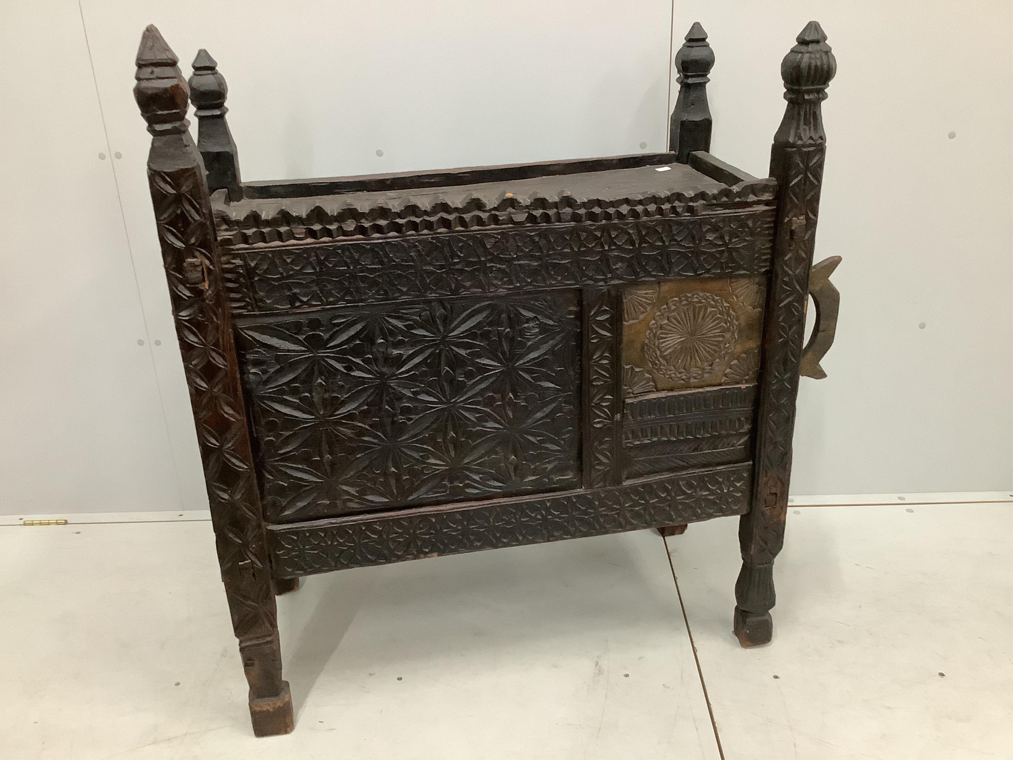 An Afghan chip carved hardwood chest, width 99cm, depth 48cm, height 116cm